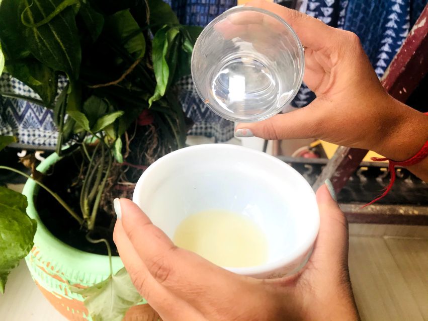 adding distilled water to the bowl